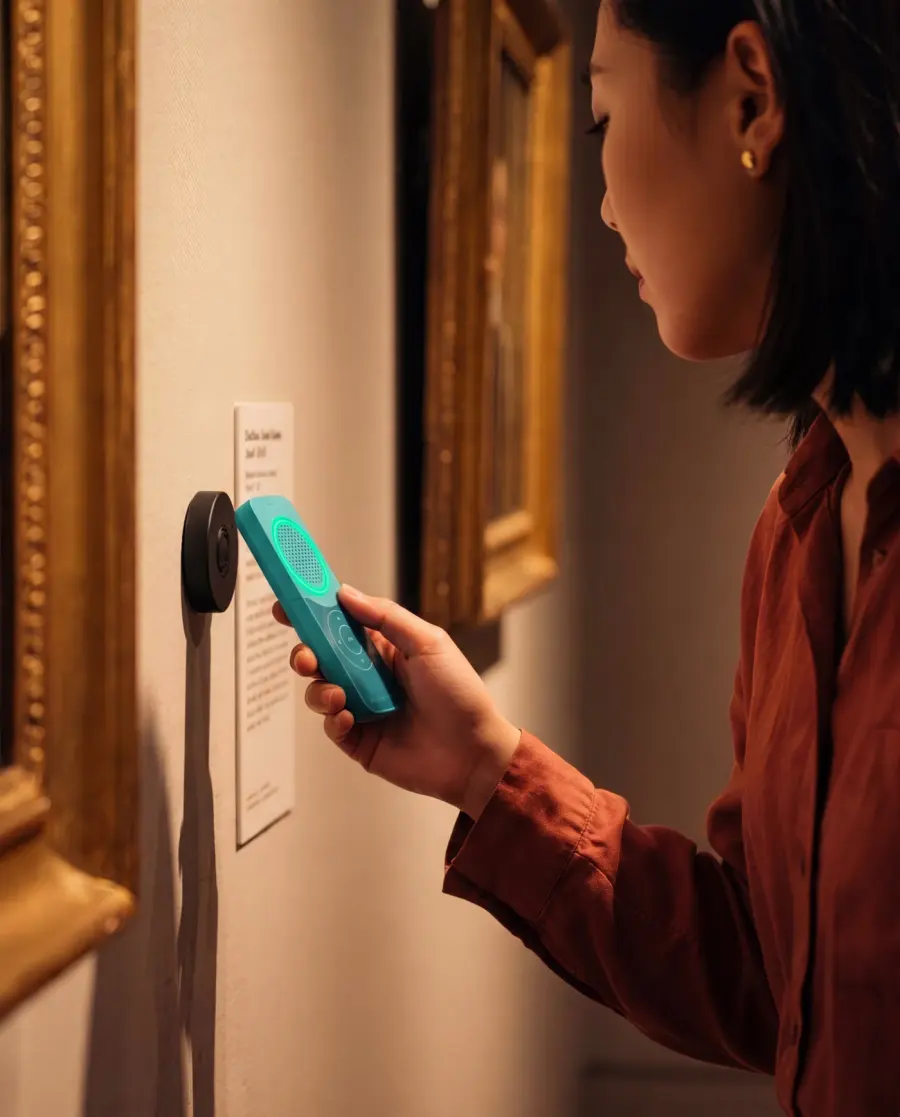 The Podcatcher held to a beacon on a gallery wall