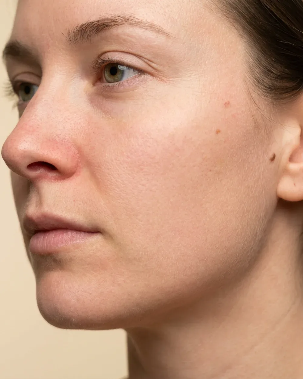 Beauty close-up with visible pores, fine hair and natural asymmetry